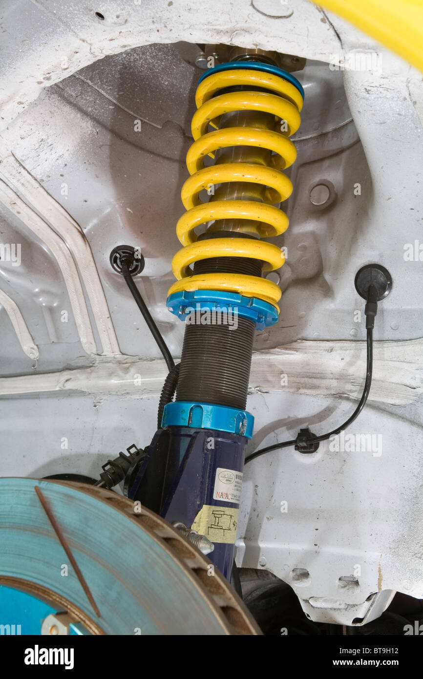 coil-over-suspension-strut-and-spring-on-a-race-car-BT9H12